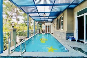 Villa for rent in Phu My Hung with large garden and swimming pool